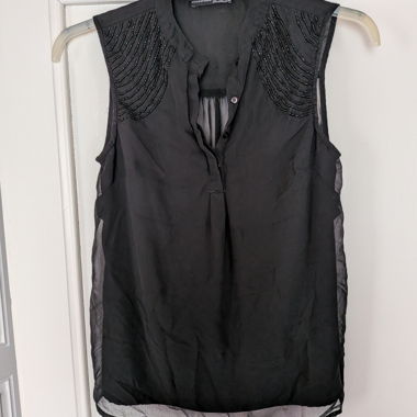 Black sleeveless top with bead embellishment