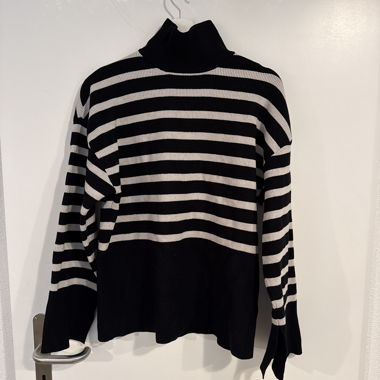 Striped black-and-white turtleneck sweater