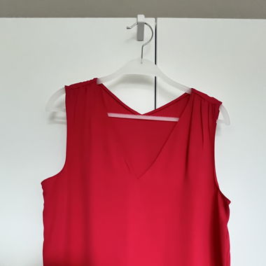 Red sleeveless blouse