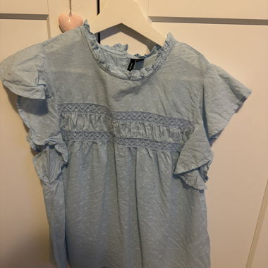 Light blue summer blouse
