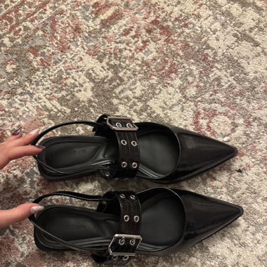 black kitten flats with chrome details