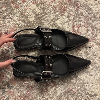 black kitten flats with chrome details