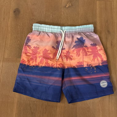 Short de bain avec imprimé palmiers
