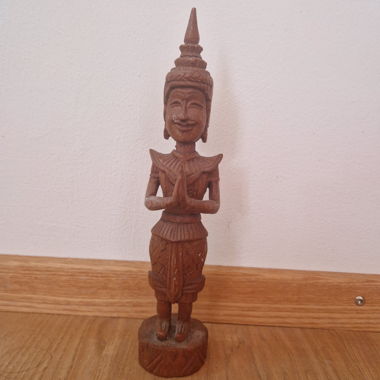Wood carved buddhist statue 