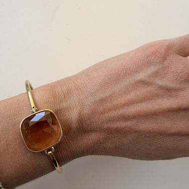 Gold-colored bangle with stone