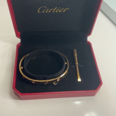 Bracciale rigido dorato con pietre