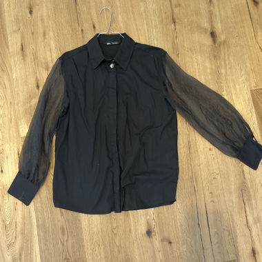 Black blouse with sheer sleeves