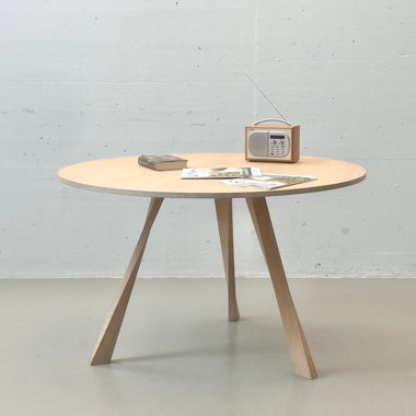 Solid wood dining table with three-legged base