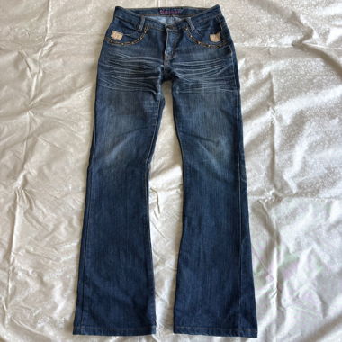 Lower waisted dome studded bootcut jeans