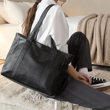 New shoulder bag made of soft black leather 