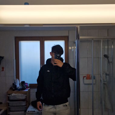 Giacca Windbreaker Nike con cappuccio