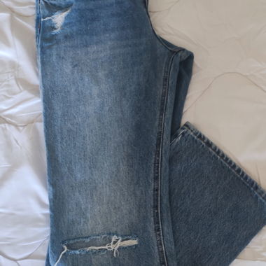 Abgenutzte blaue Jeans