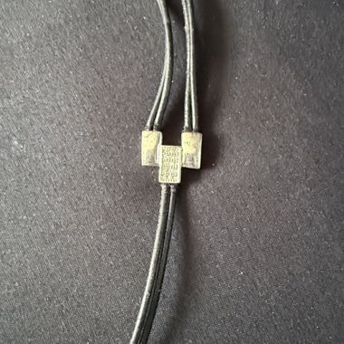 Black bracelet with metal parts