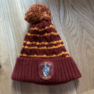 Cuffia Harry Potter Gryffindor con pon pon