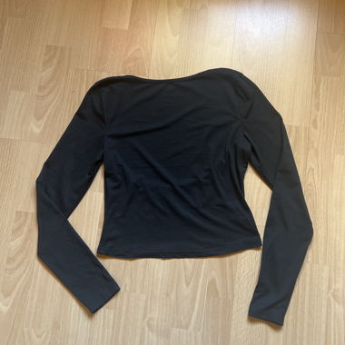 Black long-sleeve top with open back