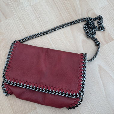 Red crossbody bag with chain