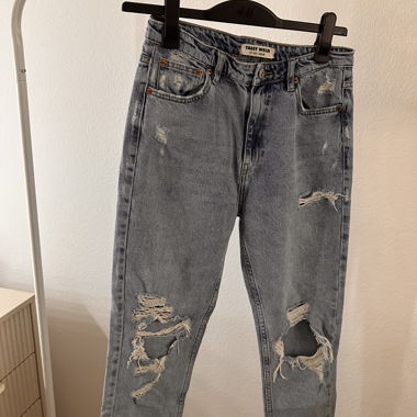 Light blue mom jeans with rips