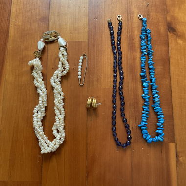 3 necklaces, 1 ring, 1 brooch 