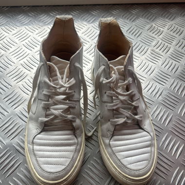 White sneakers from EKN Footwear with quilted details