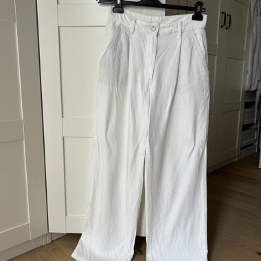 white fabric trousers