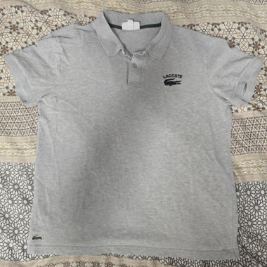 Polo Lacoste grigia