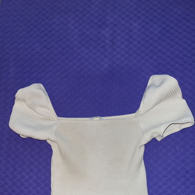 Cream colored off-the-shoulder crop top