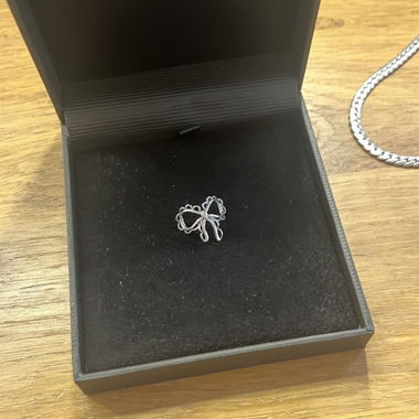 Silver bow pendant