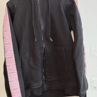 Black hooded jacket with pink sleeves