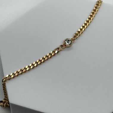 Golden necklace with stone