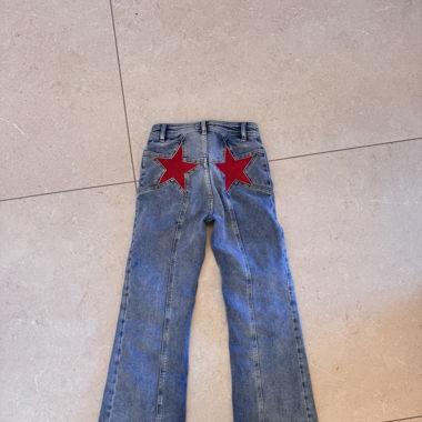 We The Free Firecracker Flare Jeans with Red Stars