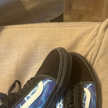 Black Vans with blue flashes