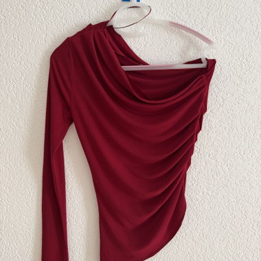 Red draped long sleeve top