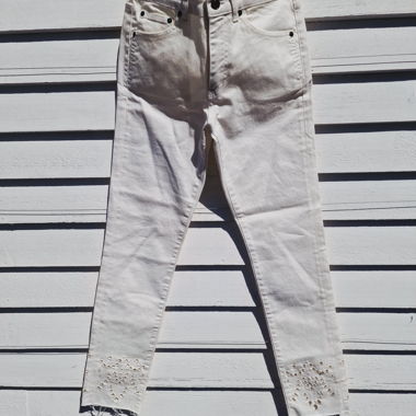 Jeans bianchi Saint Laurent con ricamo traforato