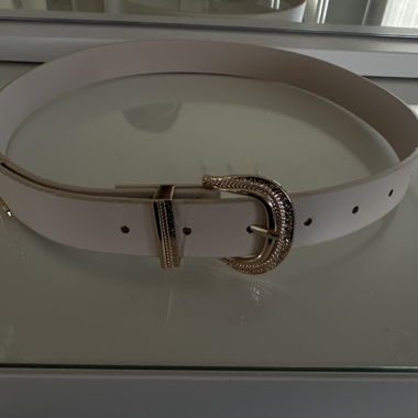 White belt with golden buckle