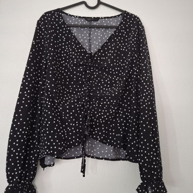 Blusa nera a pois bianchi maniche lunghe