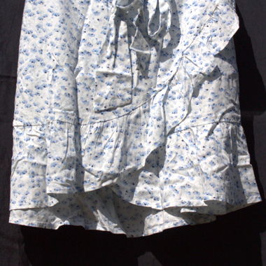 White skirt with blue flowers.