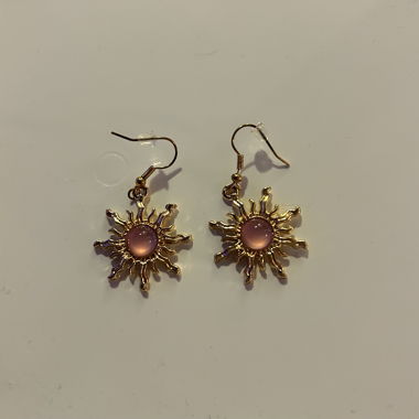 Gold-coloured sun earrings with pink stones