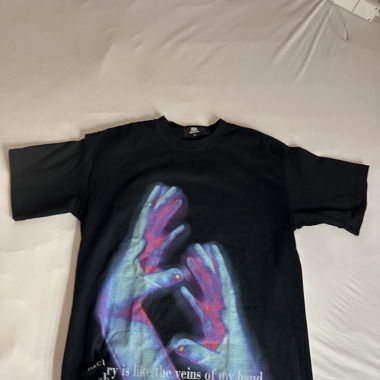 Black shirt with hands and text printed on