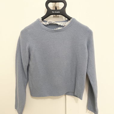 Light blue knitted sweater with lace