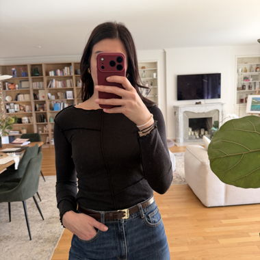 Black long-sleeve top with exposed seams