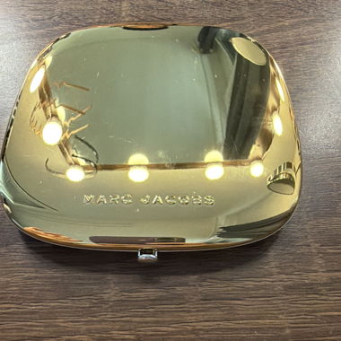 Pochette dorata Marc Jacobs