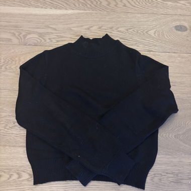 Pull noir col montant