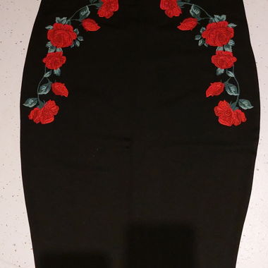 Black skirt embroidered with red roses