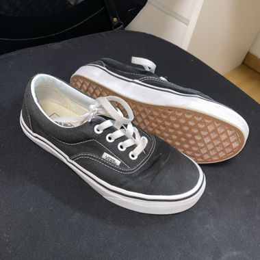 Black and white Vans Era trainers 