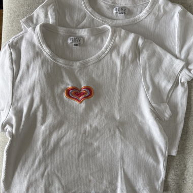 Two t-shirts with colourful heart, sizes L and XS