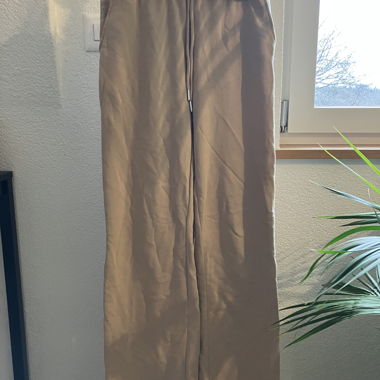 Beige wide leisure trousers with elastic waistband