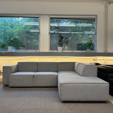 Light grey corner sofa with electric bed function