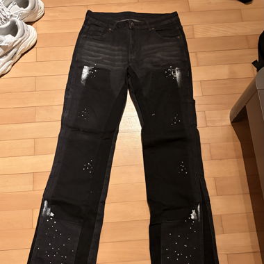 Jeans évasés noirs avec poches