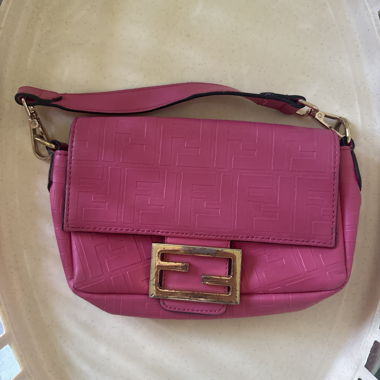 Pink shoulder bag with logo embossing