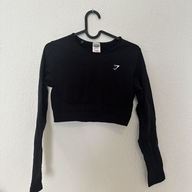 Gymshark schwarzes kurz geschnittenes Langarmtop